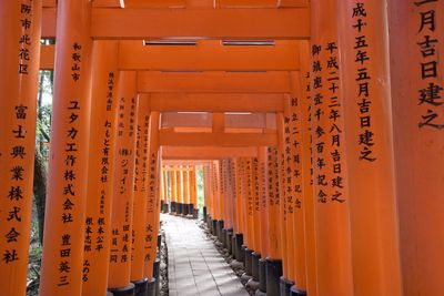 Corridor of building with orange temple