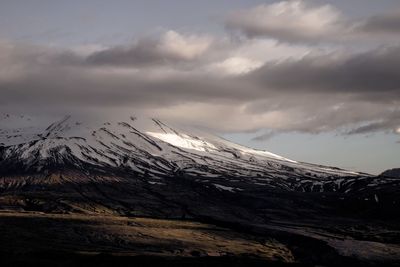 Scenic view of snowcapped mountain against sky