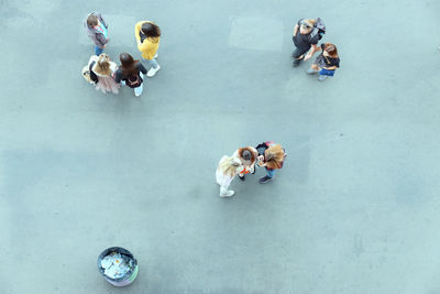 High angle view of people on floor