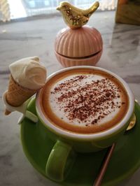 Close-up of cappuccino on table