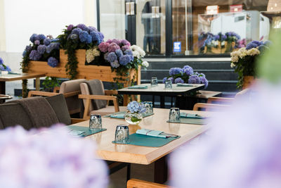 Flower vase on table in restaurant