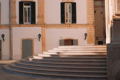 Staircase by building in city