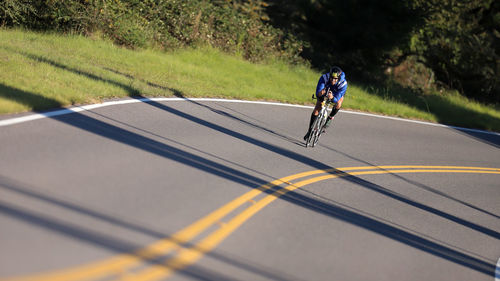 Person riding bicycle on road