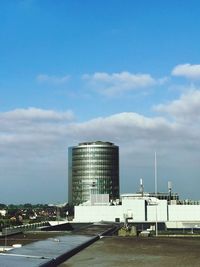 Modern buildings in city against sky