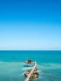 Scenic view of sea against clear blue sky at the coast of the trabocchi in the adriatic sea