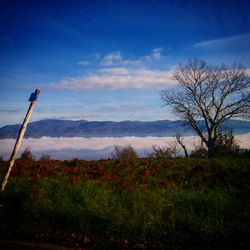 Scenic view of mountains against cloudy sky