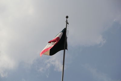 Low angle view of flag against sky