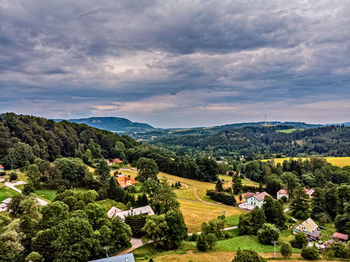 Scenic view of trees and buildings against sky