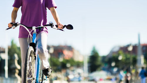 Low section of man riding bicycle