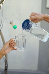 Midsection of scientist examining chemical in laboratory