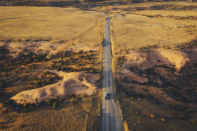 Lonely utah's road in the evening with a truck from above