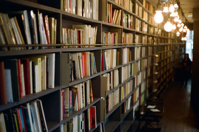 Books arranged on shelves at library