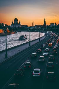 High angle view of traffic on road in city during sunset