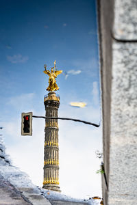 Low angle view of statue against sky