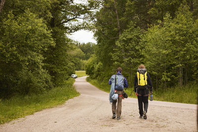 Rock climbers walking in forest