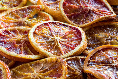 Close up macro view of slices of spiced dehydrated blood oranges.