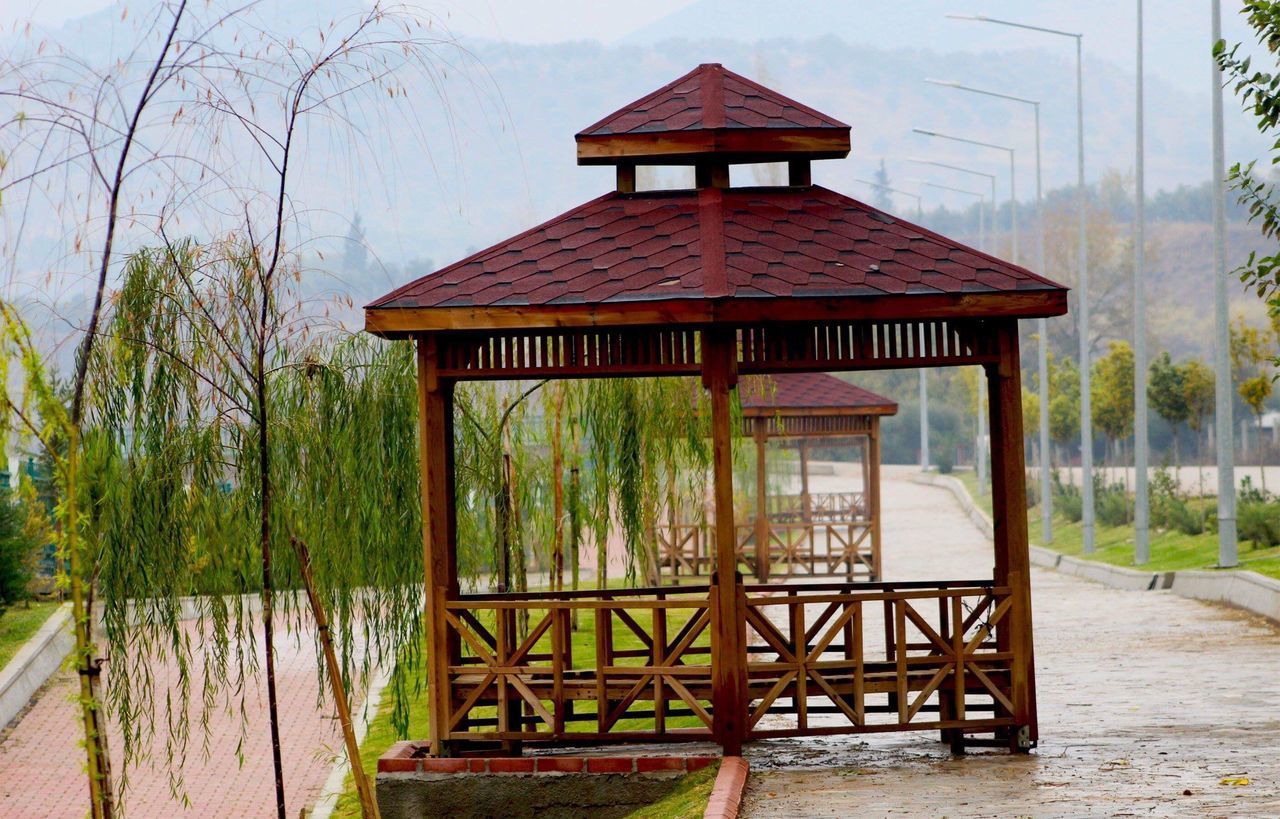 GAZEBO IN LAKE BY BUILDING