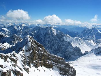 Scenic view of snowcapped mountains against sky