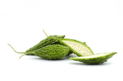 Close-up of green pepper against white background