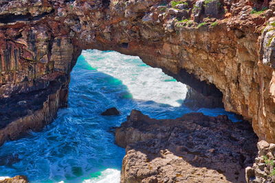 High angle view of rock formation in sea