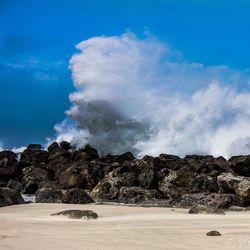 Scenic view of landscape against blue sky