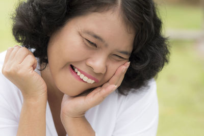 Close-up portrait of a smiling young woman