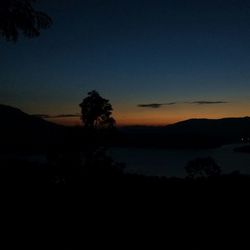 Silhouette of mountain against sky at sunset