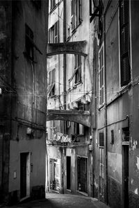 Narrow alley amidst buildings in city