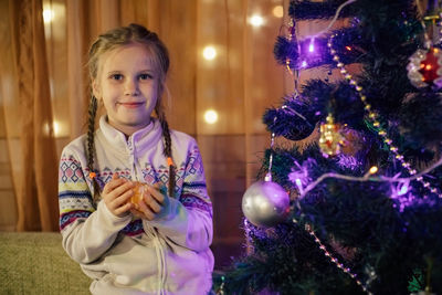 Portrait of a girl with christmas tree