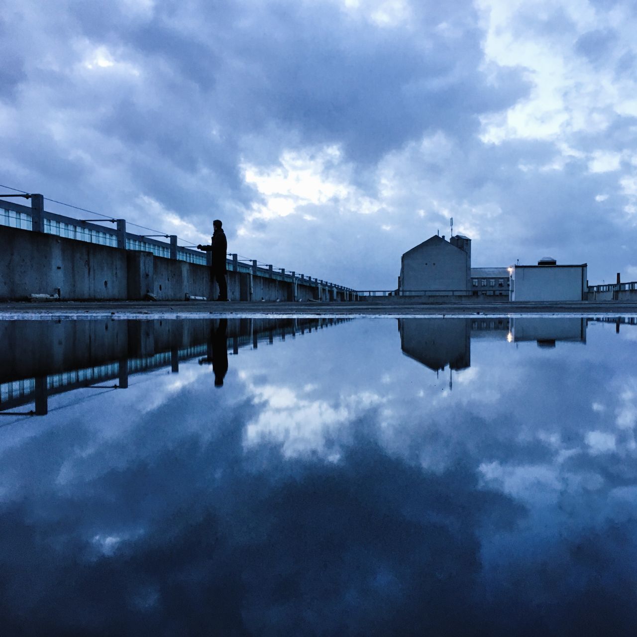 sky, architecture, cloud - sky, built structure, building exterior, cloudy, reflection, water, cloud, weather, overcast, waterfront, city, outdoors, day, nature, building, standing water, no people, lake