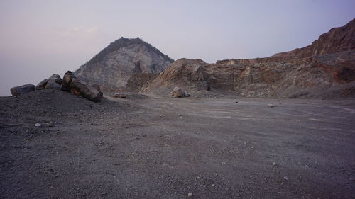 Rock formations on land against sky