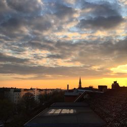 Cityscape against sky during sunset