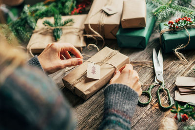 Midsection of woman holding gift