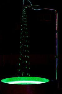 Close-up of illuminated electric lamp on table