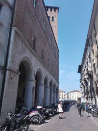 Bicycles against sky in city