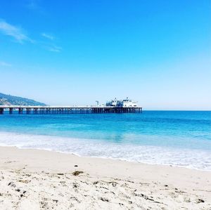 Scenic view of sea against clear blue sky