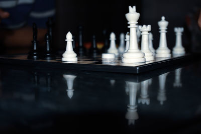 Close-up of chess pieces on table