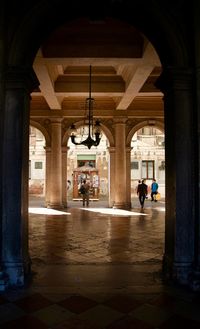 People in corridor of building