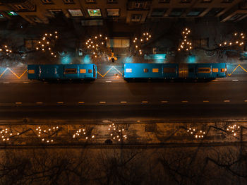 High angle view of vehicles on road at night