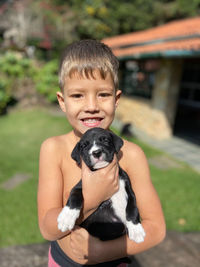 Portrait of boy with dog