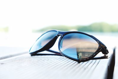 Close-up of sunglasses against blurred background