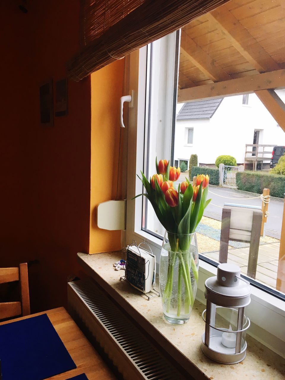 FLOWER VASE ON WINDOW SILL