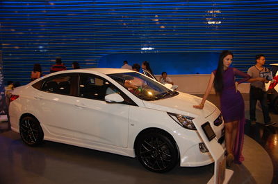 People standing on car at night