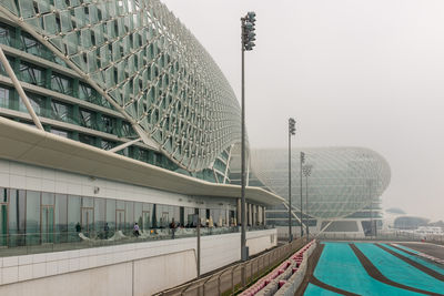 Modern buildings in city against clear sky