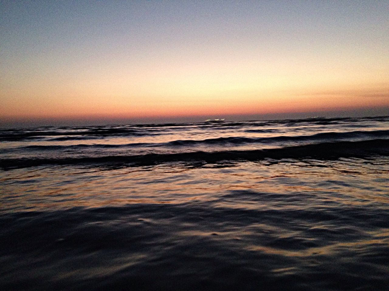 sea, horizon over water, water, sunset, scenics, beauty in nature, tranquil scene, wave, beach, tranquility, clear sky, orange color, copy space, nature, idyllic, shore, seascape, surf, sky, rippled