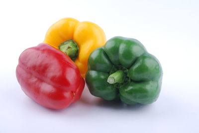 Close-up of bell peppers against white background