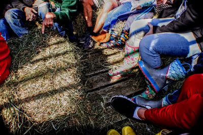 Low section of people sitting outdoors