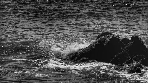 Close-up of rocks in rippled water