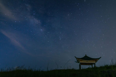 Built structure against sky at night