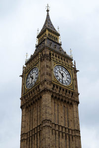 Low angle view of clock tower against sky